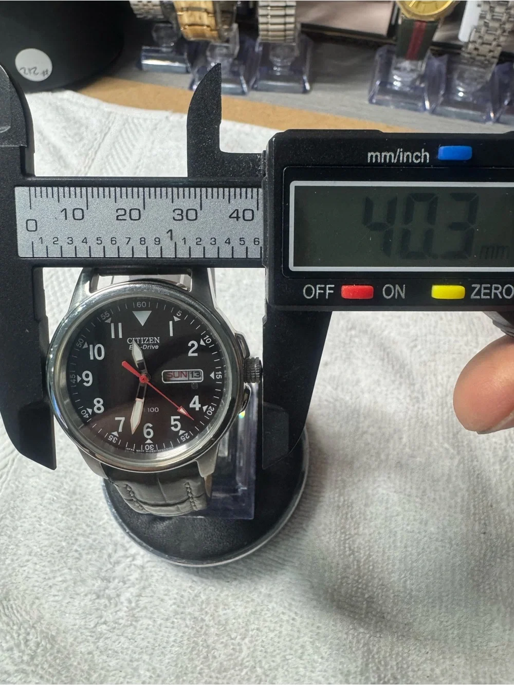 Citizen Men's Black Dial Watch with Red Second Hand and Brown Strap
